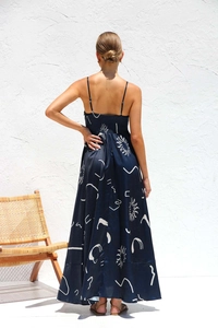 Detail of the back smocked elastic design on the navy blue floral maxi dress