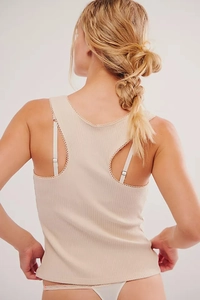 Detail of ribbed knit racerback tank top with delicate lace trim on the edges