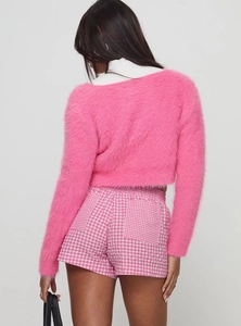 Detail showing high waist pink and white gingham shorts with cozy plush texture