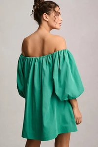 Back view of a green off-the-shoulder dress with puff sleeves and ruffled satin fabric