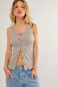 Detail of grey ribbed knit sleeveless top with U-neck and front buttons on a model
