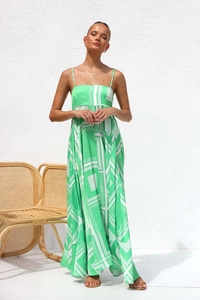 Detail of green floral print maxi dress featuring thin straps and backless design