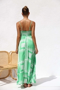 Detail of green geometric print maxi dress with elastic smocked back and thin straps