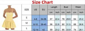 Guide des tailles pour robe courte jaune plissée incluant les mesures US/UE en cm et pouces