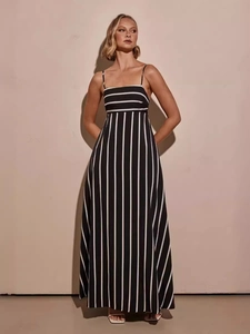 Elegant black and white striped backless maxi dress with a flowy A-line silhouette