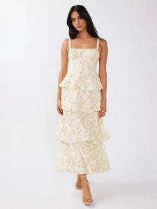 Elegant yellow floral tiered maxi dress with bow straps and a ruffled square neckline