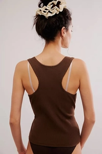 Close-up of ribbed dark brown racerback tank top featuring delicate picot trim edges