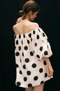 Detailed back view of off-shoulder polka dot dress with voluminous puff sleeves