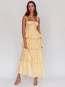 Elegant yellow floral maxi dress with spaghetti straps and tiered ruffle skirt for summer