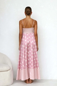 Detail of pink and white polka dot summer dress showing backless design and satin texture