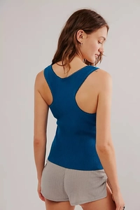 Close-up of ribbed knit tank top with delicate lace trim edges and U-shaped neckline