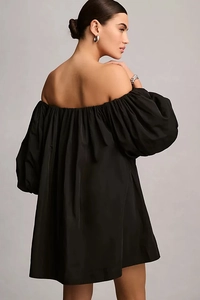 Detailed back view of a black off-shoulder puff sleeve dress with elegant pleats