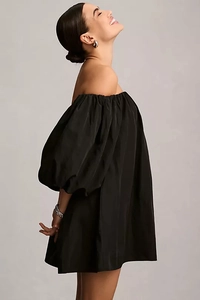 Detail view of black off-the-shoulder puff sleeve mini dress with elegant A-line silhouette