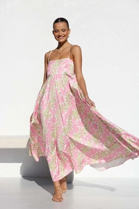 Detail of floral printed maxi dress featuring a high waist and slender spaghetti straps