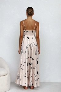 Detail of female summer backless floral maxi dress with elastic back and sun patterns