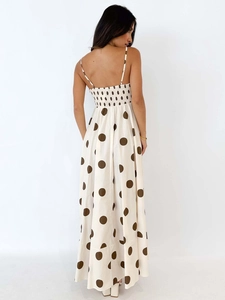 Elegant backless polka dot maxi dress with smocking detail and a high waist flowy hem