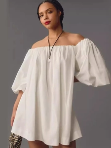 White off-shoulder mini dress with puff sleeves and elegant ruffled neckline