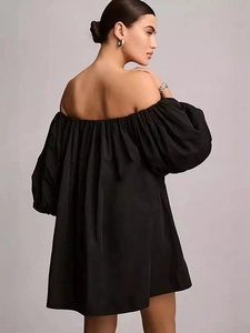 Elegant black off-the-shoulder mini dress with oversized puff sleeves and A-line silhouette