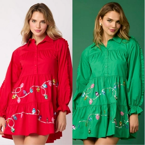 Close-up of tiered Christmas shirt dress with sequin light bulbs and ruffled sleeve detail