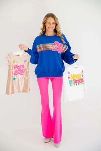 Detail of blue Merry & Bright sweatshirt and pink flared trousers for Christmas