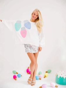 Women's white festive sweatshirt with macaron sequin light bulbs and star details