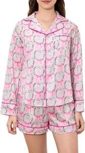 Detail of pink Christmas pajama set with silk-like fabric and Santa Claus patterns