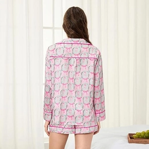 Detail of pink floral pajamas showing premium piping and smooth fabric texture from behind