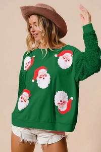 Detail view of festive dark green sweatshirt with sequin sleeves and Santa embroidery