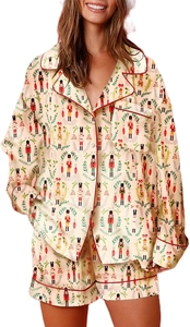 Detail view of women's Christmas pajama set with nutcracker print and red piping trim
