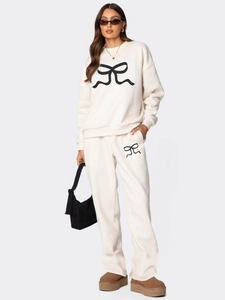 Ensemble de survêtement crème pour femme avec sweat à motif nœud noir et pantalon large