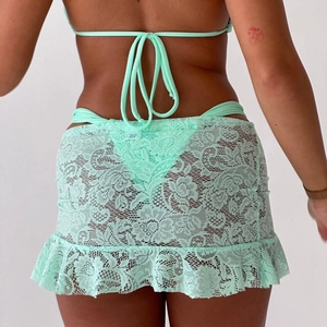 Detailed back view of mint green lace crochet swimsuit cover-up with floral patterns