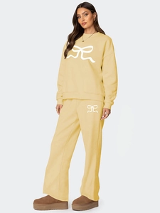 Ensemble détente deux pièces jaune clair pour femme avec sweat et motif de nœud blanc