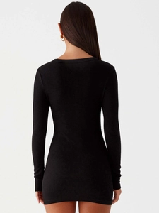 Slim fit black ribbed knit long sleeve mini dress with a sleek back view for women