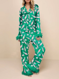Women's green satin pajama set with pink nutcracker print and feather trim decoration