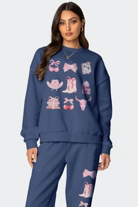 Detail of navy blue fleece tracksuit with pink bow and cherry coquette prints