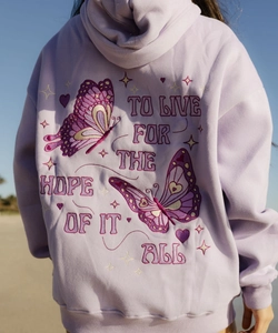 Close-up of lavender hoodie with detailed butterfly embroidery and hopeful quote on back
