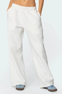 Détail du pantalon de jogging blanc large avec taille élastique et poches latérales