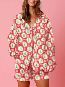 Silk satin Christmas pajama set with tree prints, long sleeve shirt and shorts on model
