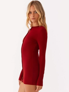 Slim fit dark red ribbed knit long sleeve dress with button detail on white background