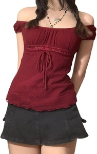 Detail view of burgundy mesh lace off-shoulder top with drawstring bow and floral texture