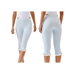 Detail showing blue plaid capri leggings with white lace trim on the ruffled hem