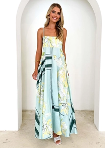 Detailed view of floral print on light green A-line dress with lightweight fabric texture