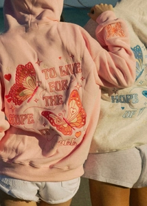 Detailed butterfly embroidery and quote on back of oversized cotton hooded sweatshirts