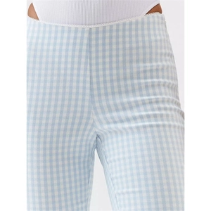 Detail of high waist plaid pants with delicate scalloped trim and invisible side zipper