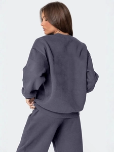 Women's oversized dark grey tracksuit set featuring crewneck sweatshirt and casual pants