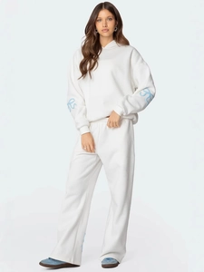 Ensemble sweat à capuche et pantalon large blanc pour femme avec broderie nœud bleu