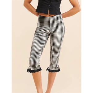 Detail of gingham cropped leggings featuring lace trim and ruffled hems for women