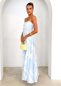 Detail of summer floral backless maxi dress with yellow woven bag in bright gallery