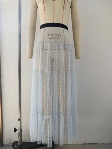Detail of light blue tiered tulle midi skirt featuring white heart patterns and elastic waist