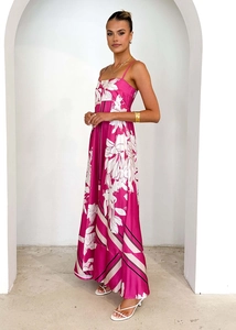 Detail view of pink floral backless maxi dress with delicate straps and satin finish